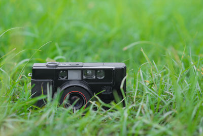 Close-up of camera on field