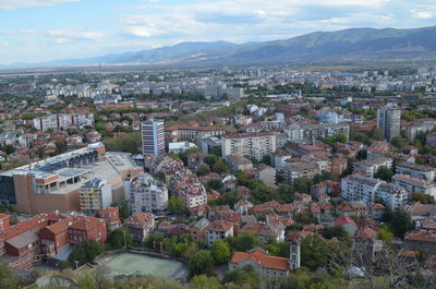 Cityscape with mountain range in background