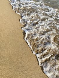 High angle view of surf on beach