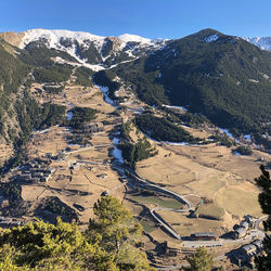 High angle view of snowcapped mountains against sky