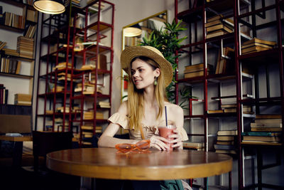 Portrait of woman sitting in restaurant