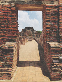 View of old building against cloudy sky