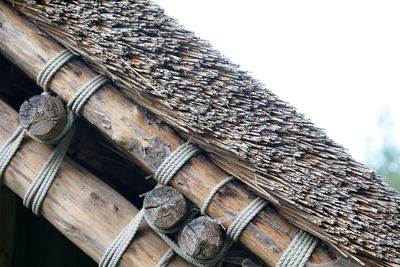 Low angle view of wooden logs