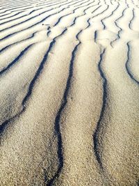 High angle view of shadow on sand