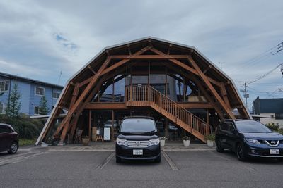 Car on road against sky in city