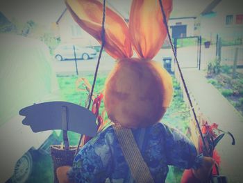 Rear view of girl playing outdoors