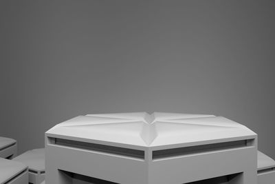 Close-up of empty table against white wall at home