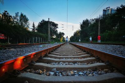 People on railroad tracks