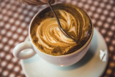 High angle view of cappuccino on table