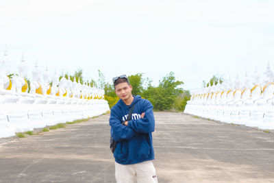 Portrait of a handsome young man standing outdoors