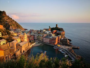 High angle view of buildings by sea