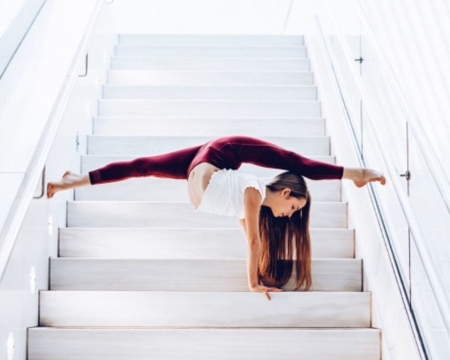 one person, staircase, women, adult, young adult, lifestyles, steps and staircases, architecture, full length, relaxation, female, white, hairstyle, indoors, clothing, elegance, long hair, stairs, wellbeing, railing, person, fashion, exercising, brown hair, portrait, balance, sitting, day, stretching