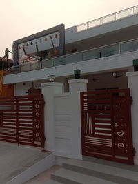 Closed door of building against sky