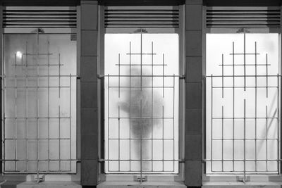 Man stands near frosted window