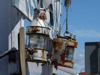 Low angle view of machinery against sky