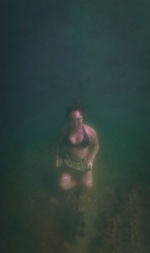 Portrait of woman swimming in sea