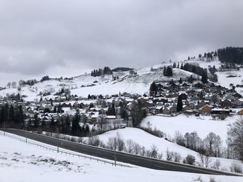 Snow covered trees against sky