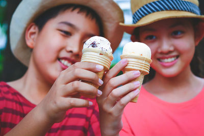 Portrait of boy holding ice cream