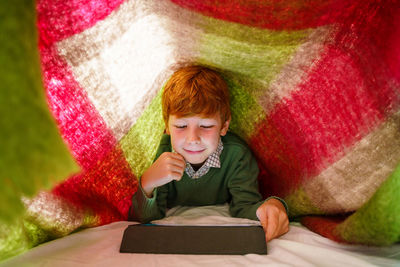 Portrait of boy with open book