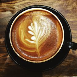 Close-up of cappuccino on table