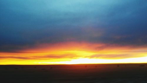 Scenic view of dramatic sky during sunset