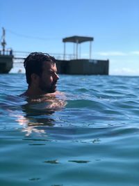 Portrait of man swimming in sea