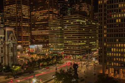 High angle view of city lit up at night