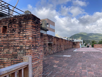 Buildings in city against sky