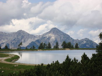 Scenic view of lake and mountains against sky