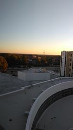 Cityscape against clear sky during sunset