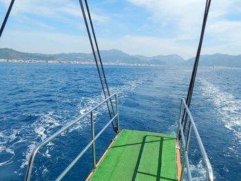 Sailboat sailing on sea against sky