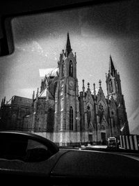 Low angle view of church and building against sky