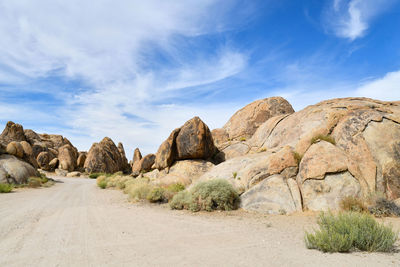 Panoramic view of road amidst rocks against sky