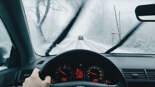 Cropped image of car on road