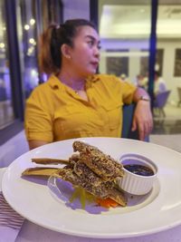 Young woman having food