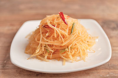 High angle view of noodles in plate on table