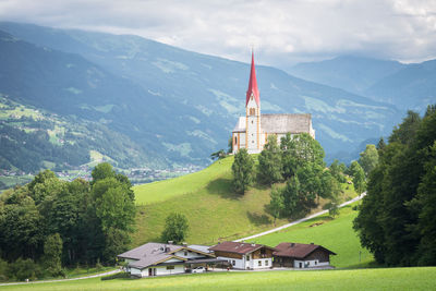 Church of sankt pankraz in zillertal, austria. classic austrian scene of a church on a hill.