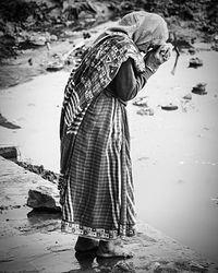 Woman standing in water