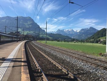 View of railroad tracks against cloudy sky