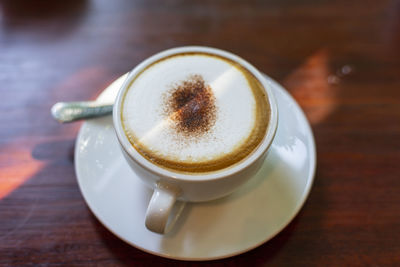 High angle view of coffee cup on table