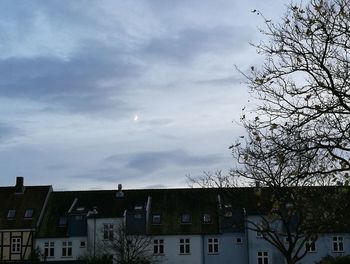 Houses against sky in city