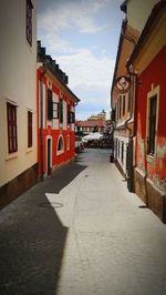 Empty alley amidst buildings in town