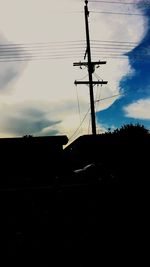 Low angle view of electricity pylon against sky