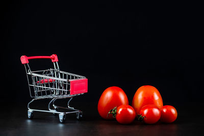 Close-up of tomatoes against black background