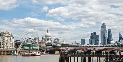 Bridge over river with buildings in background