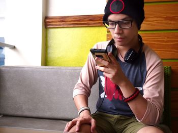 Teenager using mobile phone