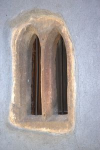 Close-up of rusty window on old building