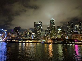 Illuminated city at waterfront