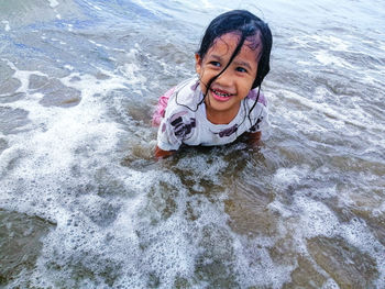 Portrait of smiling girl in sea