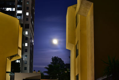 Low angle view of building against cloudy sky